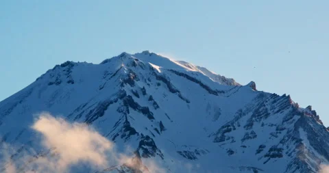 Closeup of wind blowing snowy peak of mountain Stock Footage 220893211