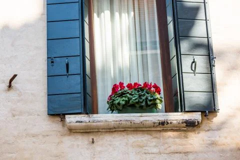 Closeup on windows windows of a typical Venetian house, Italy Stock Photos