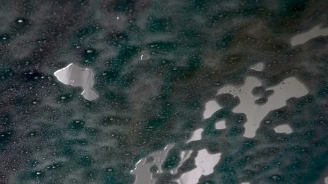 Closeup of windscreen or windshield of car going through a touchless car washing Stock Footage 90500788