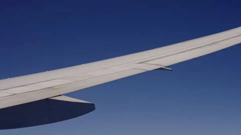 Closeup of a wing during a flight Stock Footage 268696655
