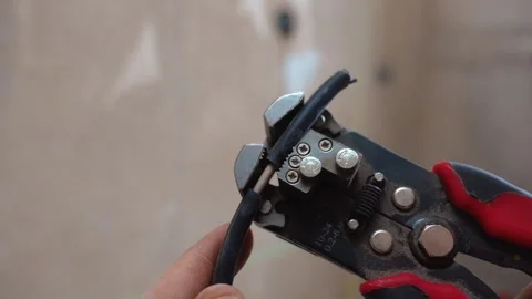 Closeup Of Wire Cutter Removing Insulation For Connector Setup Process Vídeo Stock 328521488
