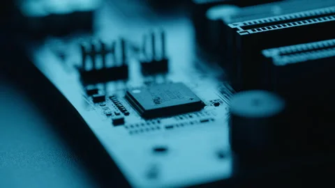 Closeup wires link core components across engineered circuit board. Processor Stock Footage 332672922