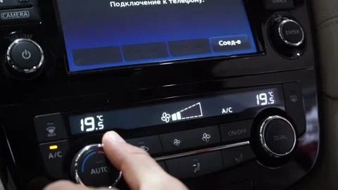 Closeup woman adjust air flow up speed on console button panel Stock Footage 169030053