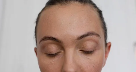 Closeup of woman doing makeup of eyebrows Stock Footage 103785552