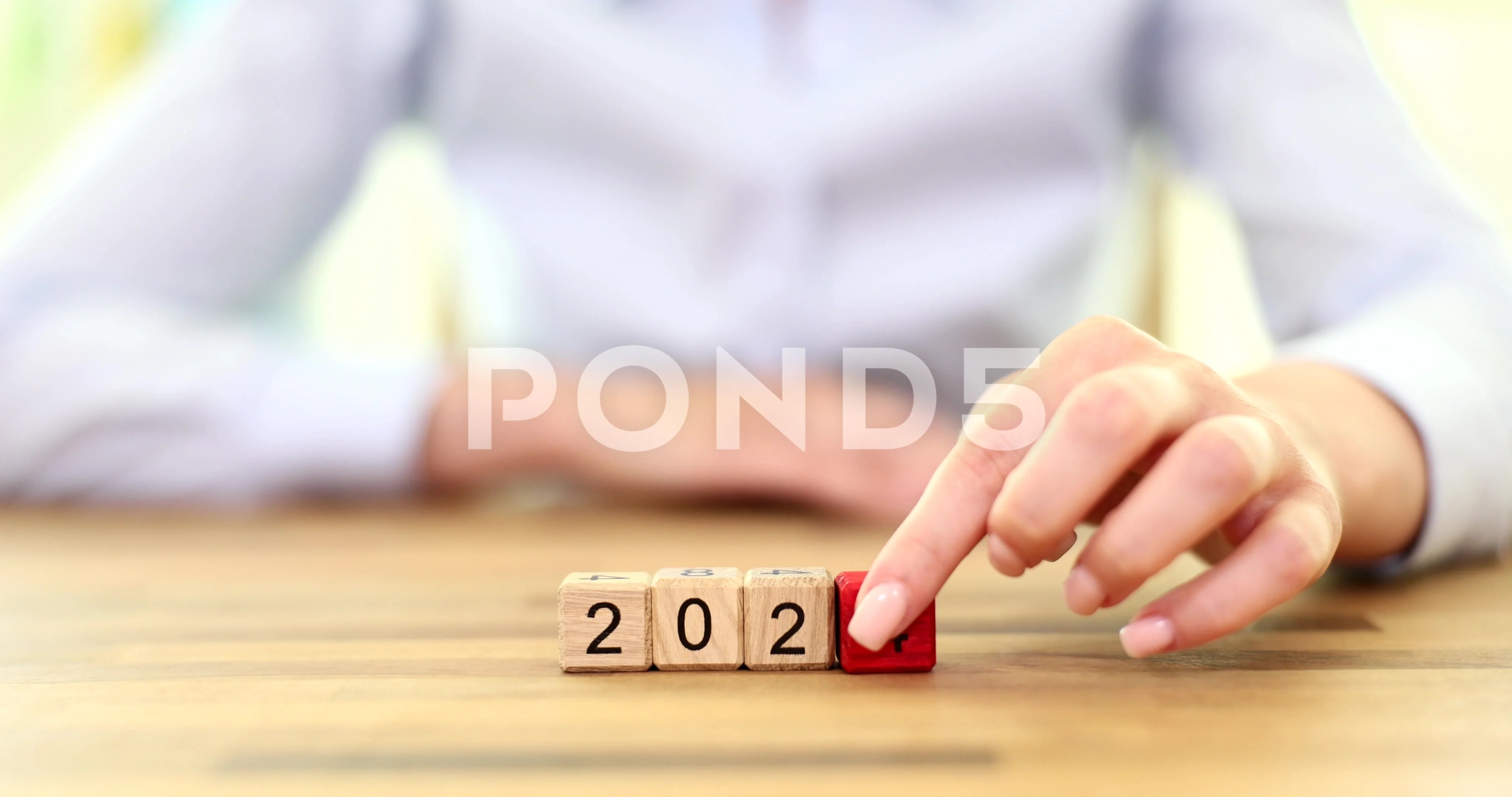 Hand Flipping Of 2023 To 2024 On Wooden Block Cube For Preparation