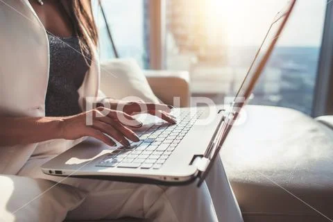 Closeup of woman hands typing on laptop keyboard Stock Photos