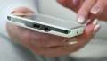 Closeup of woman hands with white smartphone HD Footage