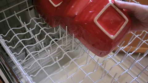 Closeup of Woman Loading a Dishwasher Stock Footage 64111700