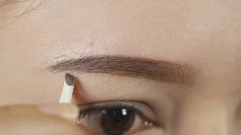 Closeup of a woman making a shape eyebrows with tweezers Stock Footage 76470661