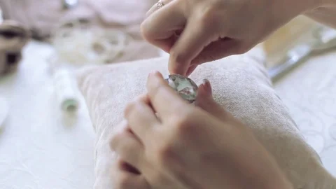 Closeup of woman sews decor Stock Footage 74228341