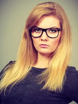 Closeup of woman thinking face expression Stock Photos