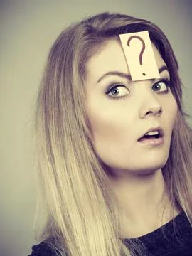 Closeup of woman thinking face expression Stock Photos
