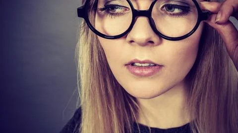Closeup of woman thinking face expression Stock Photos