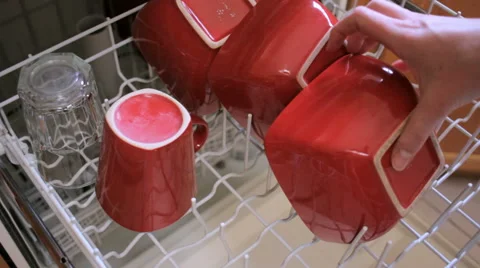 Closeup of Woman Unloading a Dishwasher Stock Footage 64112064