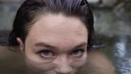 Closeup Of Woman's Eyes, The Rest Of Her Face Is Submerged In Water Stock Footage