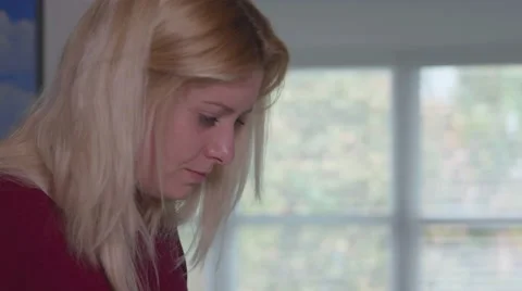 Closeup Woman's Face as She Uses iPad at Table Video stock 59733590
