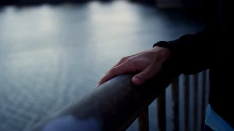 Closeup Of Woman's Hand Holding Railing, Walks Up Ramp On Waterfront Stock Footage 96017547