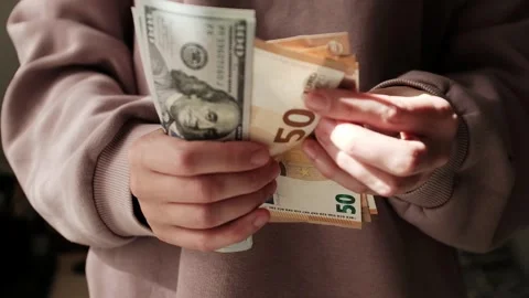 Closeup of woman's hands counting dollar cash banknotes. Stock Footage 318898102