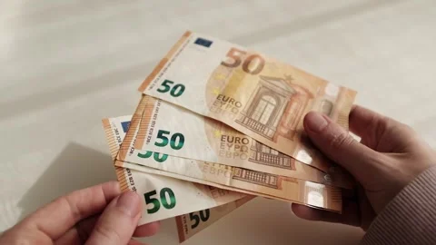 Closeup of woman's hands counting Euro cash banknotes. Woman calculates income Stock Footage 318898158