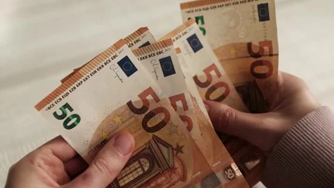 Closeup of woman's hands counting Euro cash banknotes. Woman calculates income Stock Footage 318898169