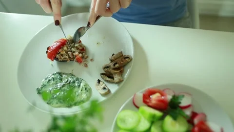 Closeup of woman's hands eating lunch with salad Stock Footage