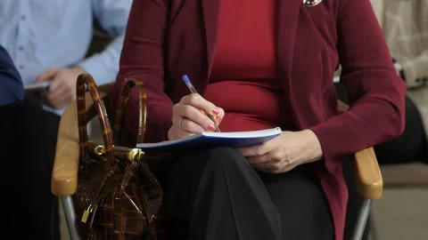 Closeup woman's hands making notes during seminar Stock Footage 108007746