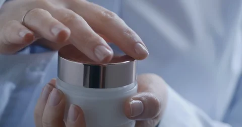 Closeup of woman's hands opening container with face cream. Stock Footage 130145807