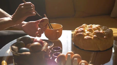 Closeup Of Woman's Hands Painting Easter Eggs, Coloring Eggs, Easter Bread Video stock 128660438