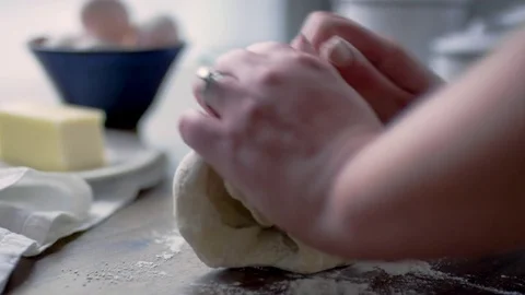 Closeup Of Woman's Hands, Puts Dough On Table, Sprinkles Flour And Kneads Dough Video stock 82380383