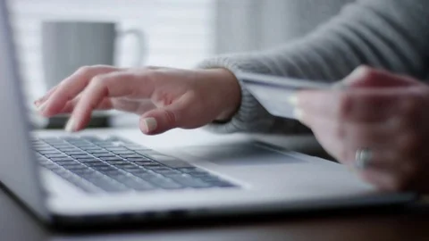 Closeup Of Woman's Hands, She Uses Laptop To Online Shop Or Pay Bills From Home Видео 82331493