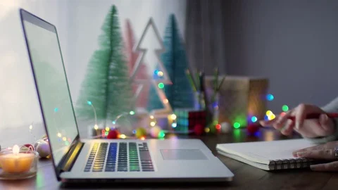 Closeup Of Woman's Hands, She Writes In A Notebook And Uses Her Laptop, At Home Stock Footage 82334598