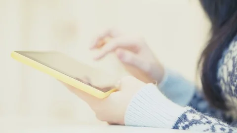 Closeup of woman's hands with tablet. Beautiful brunette using tablet. Stock Footage 84739535