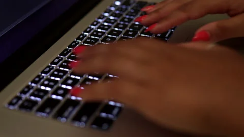 Closeup of woman's hands typing on his laptop Stock Footage 138207361