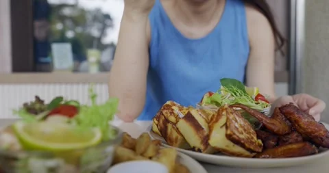 Closeup of a woman's hands using a fork to eat breakfast Stock Footage 257043736