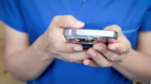 Closeup of woman's hands using smartphone Stock Footage 244382027