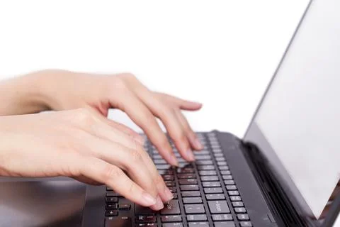 Closeup of women's hands touching type notebook (laptop) keys during work b.. Stock Photos