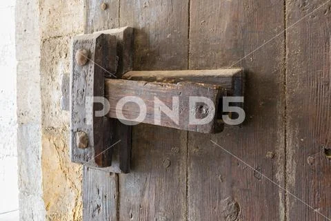 Closeup of a wooden aged latch Stock Photos
