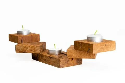 Closeup of a wooden textured rectangular candlestick for three candles isolat 스톡 사진