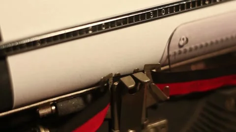 Closeup of the words "economic slowdown" written on a typewriting machine Stock-Footage 8694601