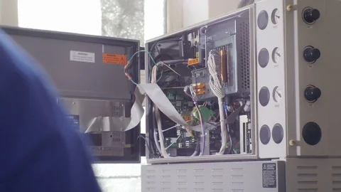 Closeup Worker Closes Equipment Section against Sunshine Stock Footage 79501413