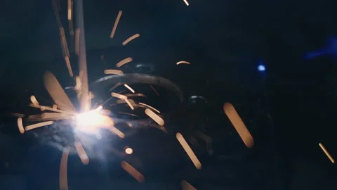 Closeup worker man using electric arc welding machine to weld steel Stock Footage 166884732