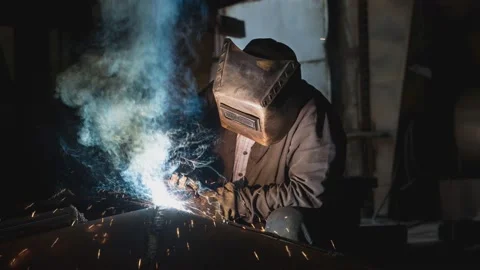 Closeup worker in a mask doing the welding in a workshop. Cinemagraph. Stock Footage 201359281
