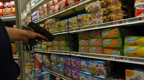 Closeup of worker's hands scanning yoghurt at supermarket Video stock 45296702