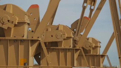 Closeup of working oil derrick pump in petroleum field B Video stock 125638770