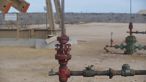 Closeup of working oil derrick pump in petroleum field E Stock Footage 125638823