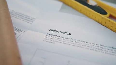 Closeup, workspace and building proposal for architecture, information and Video stock 344253370