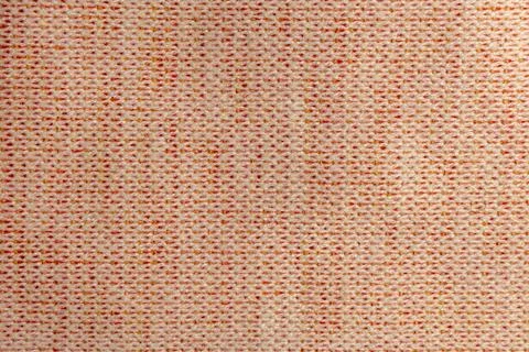 Closeup woven textile surface with pink cream orange thread pattern 写真素材