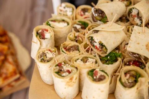 A closeup of wraps on the table under the lights with a blurry background Stock Photos