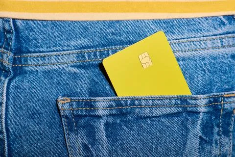 Closeup of a yellow debit card with a microchip sticking out of the back po.. Stock Photos