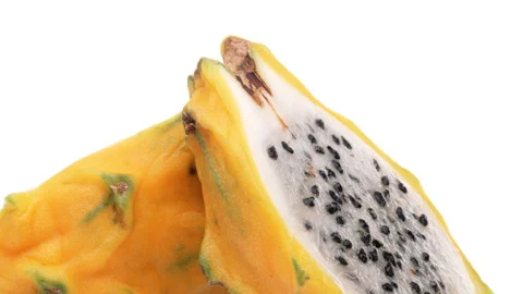 Closeup of yellow dragon fruit halves rotating. Isolated on white background. Stock Footage 158918997
